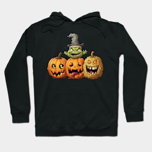 Three Halloween Pumpkins with Different Expressions and a Witch Hoodie